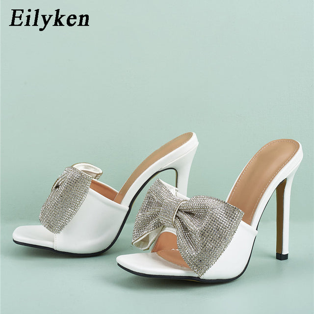 Eilyken Newest Fashion Crystal Rhinestone Butterfly-knot Women Summer Party Slippers Square Toe Sandals Thin High Heels Ladies